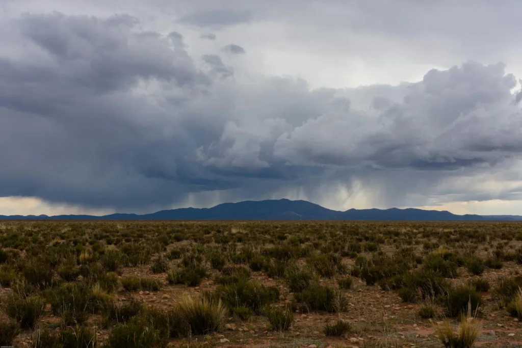 Capturing a stormy landscape in Yavi, Argentina with dramatic clouds over expansive plains.